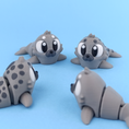 Load image into Gallery viewer, Krew3D Printables - Articulated Baby Seal - 3D Printed, Articulated, and Super Wiggly | 3D Printed Flexible Fidget Collectible Gift for Kids & Adults | 3DGOB