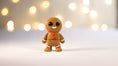 Load image into Gallery viewer, Krew3D Printables - Tiny Gingerbread Man - 3D Printed, Articulated, and Super Wiggly | 3D Printed Flexible Fidget Collectible Gift for Kids & Adults | ZOU3D
