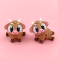 Load image into Gallery viewer, Flexi Baby Cow – 3D Printed, Articulated, and Super Wiggly
