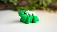 Load image into Gallery viewer, Krew3D Printables - Tiny Stegosaurus - 3D Printed, Articulated, and Super Wiggly | 3D Printed Flexible Fidget Collectible Gift for Kids & Adults | ZOU3D
