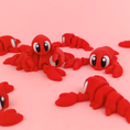 Load image into Gallery viewer, Krew3D Printables - Articulated Baby Lobster w/optional Chef Hat - 3D Printed, Articulated, and Super Wiggly | 3D Printed Flexible Fidget Collectible Gift for Kids | 3DGOB
