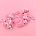 Load image into Gallery viewer, Flexi Baby Cherry Blossom Dragon – 3D Printed, Articulated, and Super Wiggly
